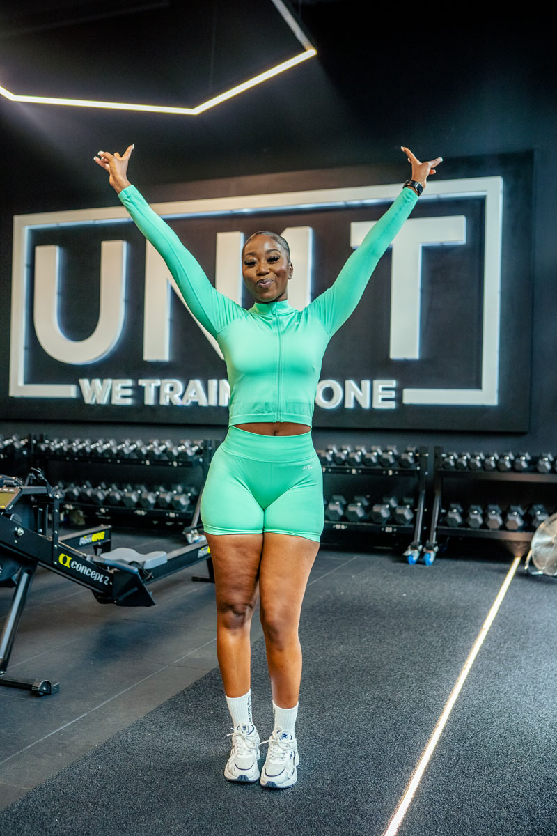 The coach is posing with her confidence.